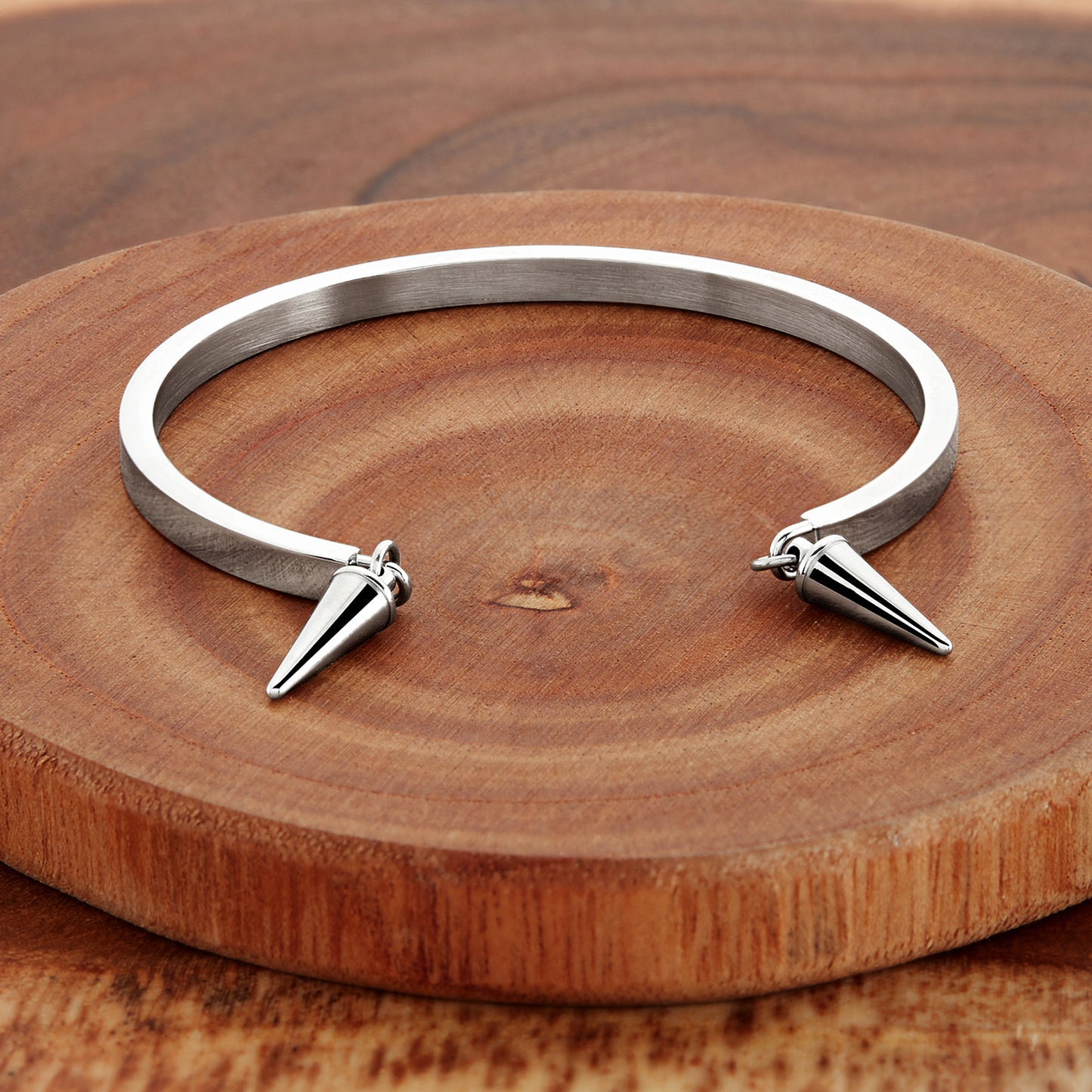 ELYA Women's Polished Cone Charms Steel Cuff Bracelet