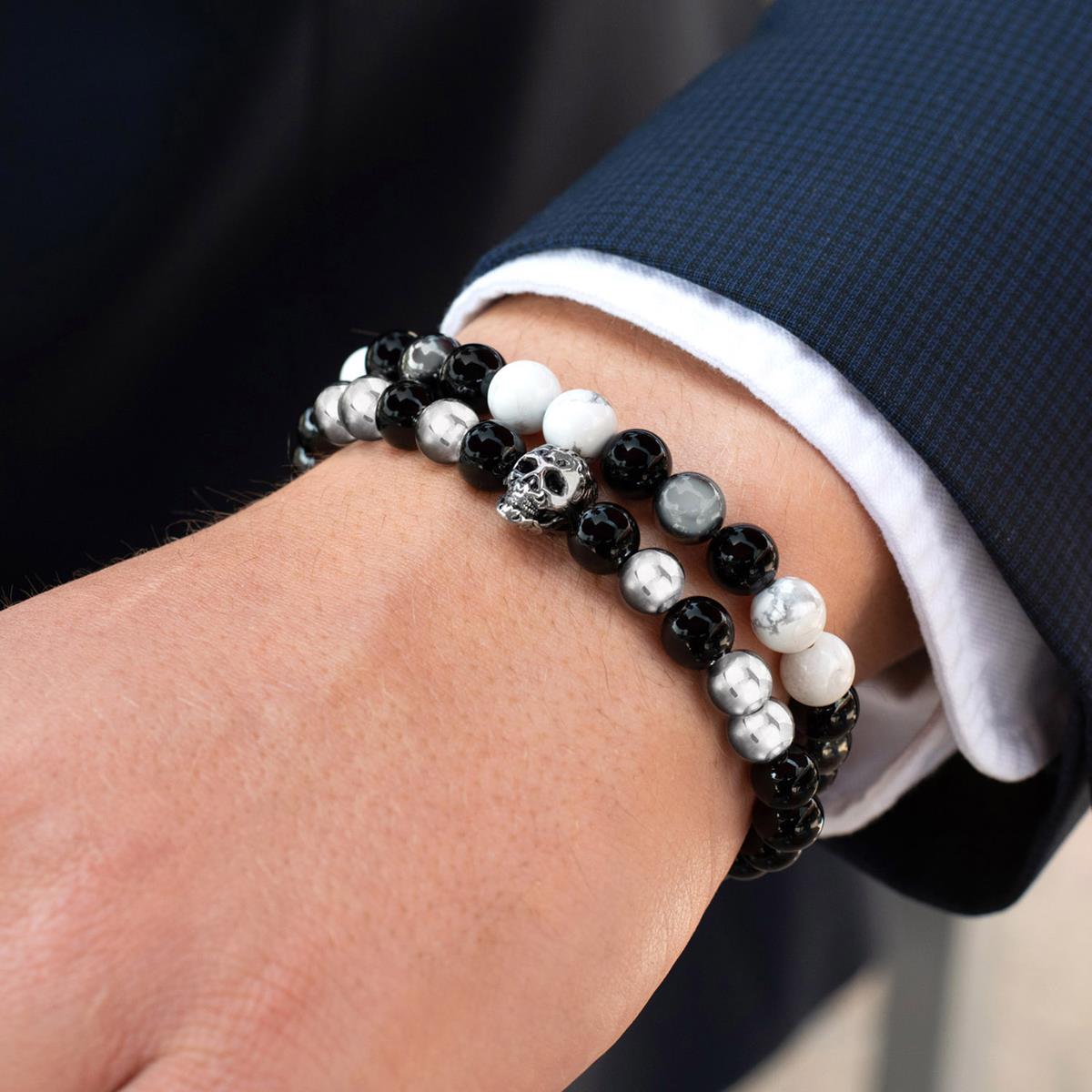 Center polished onyx beaded bracelet with silver good skull bead and logo ring