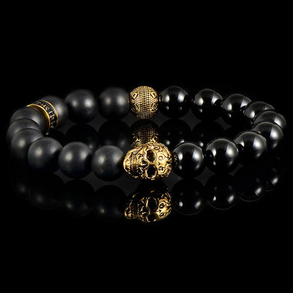 Crucible Jewelry Single Gold Skull Stretch Bracelet with 10mm Matte and Polished Black Onyx Beads