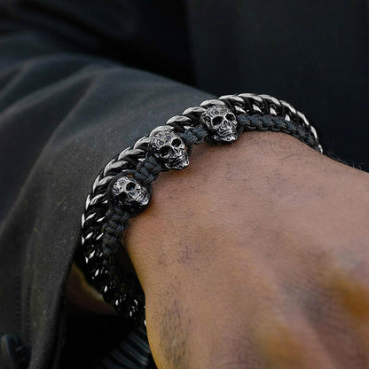 Crucible Jewelry Three Black IP Skulls on Shocker Tie Woven Bracelet