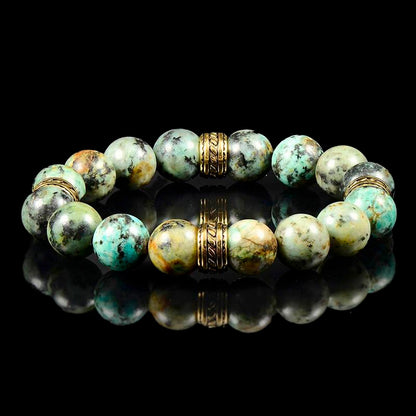 Crucible Los Angeles 12mm African Turquoise Bead Stretch Bracelet with Gold IP Stainless Steel Tribal Accent Beads